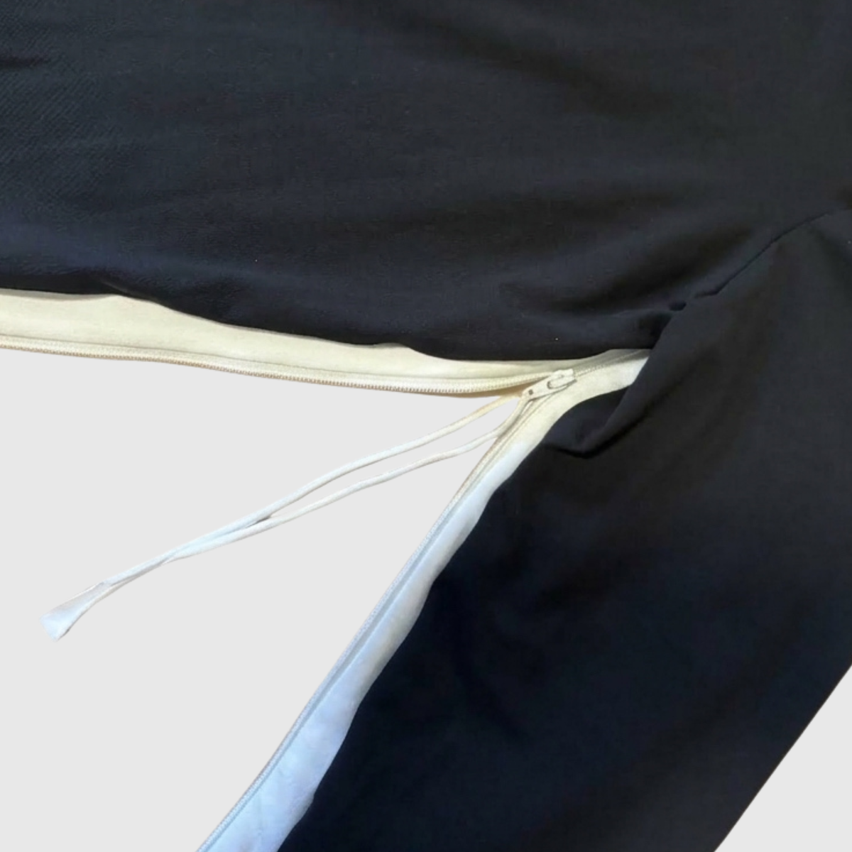 Sleeve zipper open at the armpit, showing the separating zipper and slider