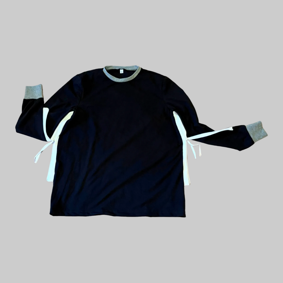 Webbed Apparel Sleep Shirt with Arm Control — black long-sleeve shirt with a zipper along each sleeve, flat lay
